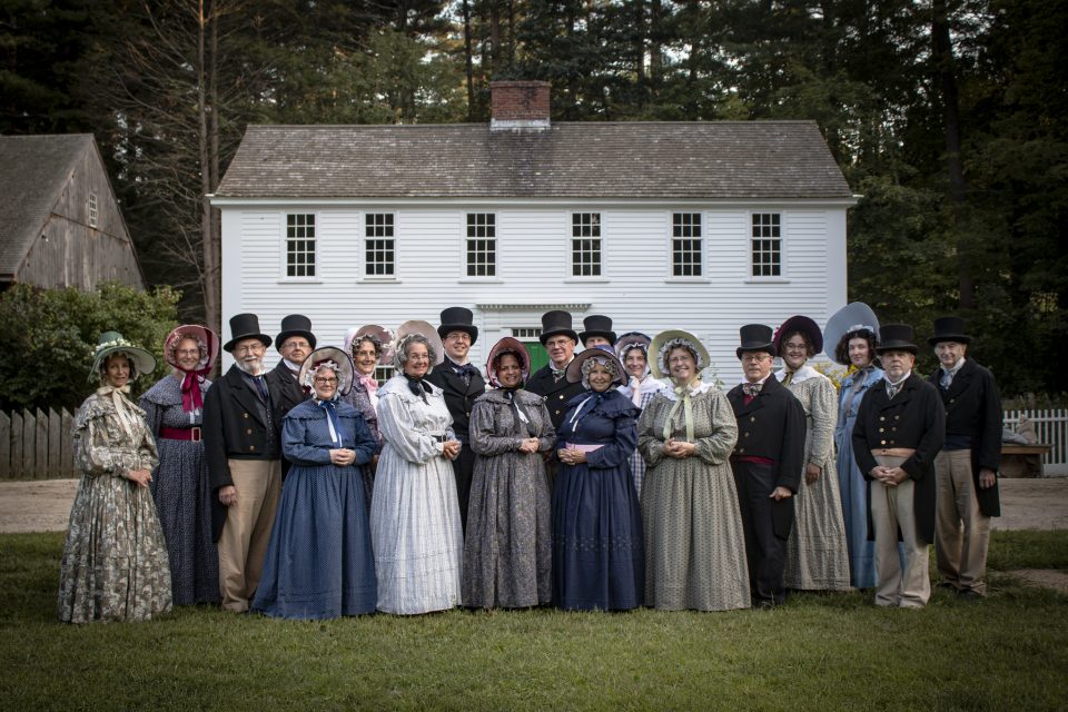 A group of people in 1830s costume