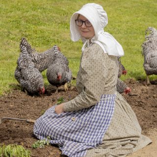 Gardener planting and digging in the dirt.