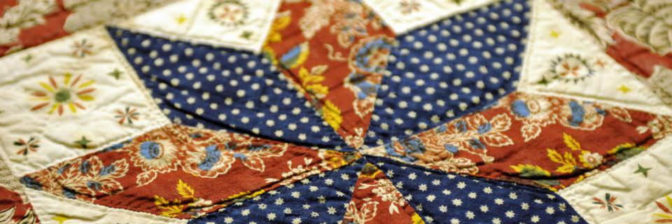 Closeup of a handmade quilt from 1837