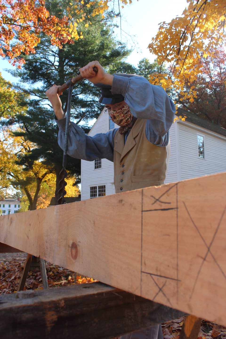Using a auger on a beam for the Cabinetmaking Shop