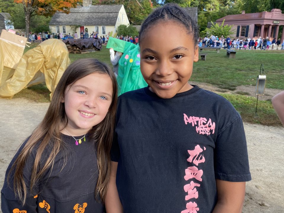 Two elementary school students smile for the camera