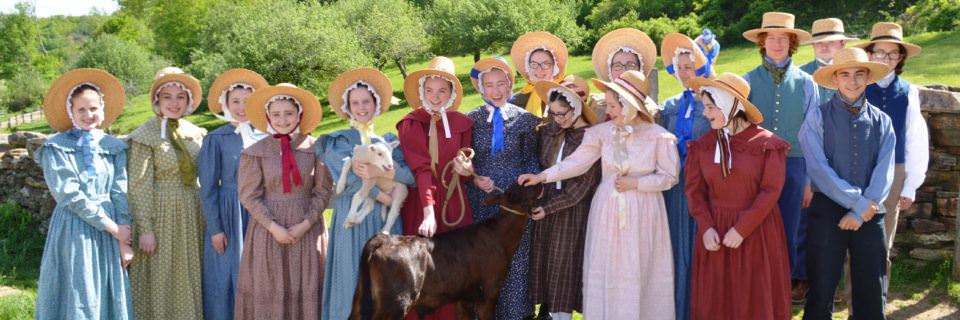 A group of junior (high school) interns in costume at the Freeman Farm