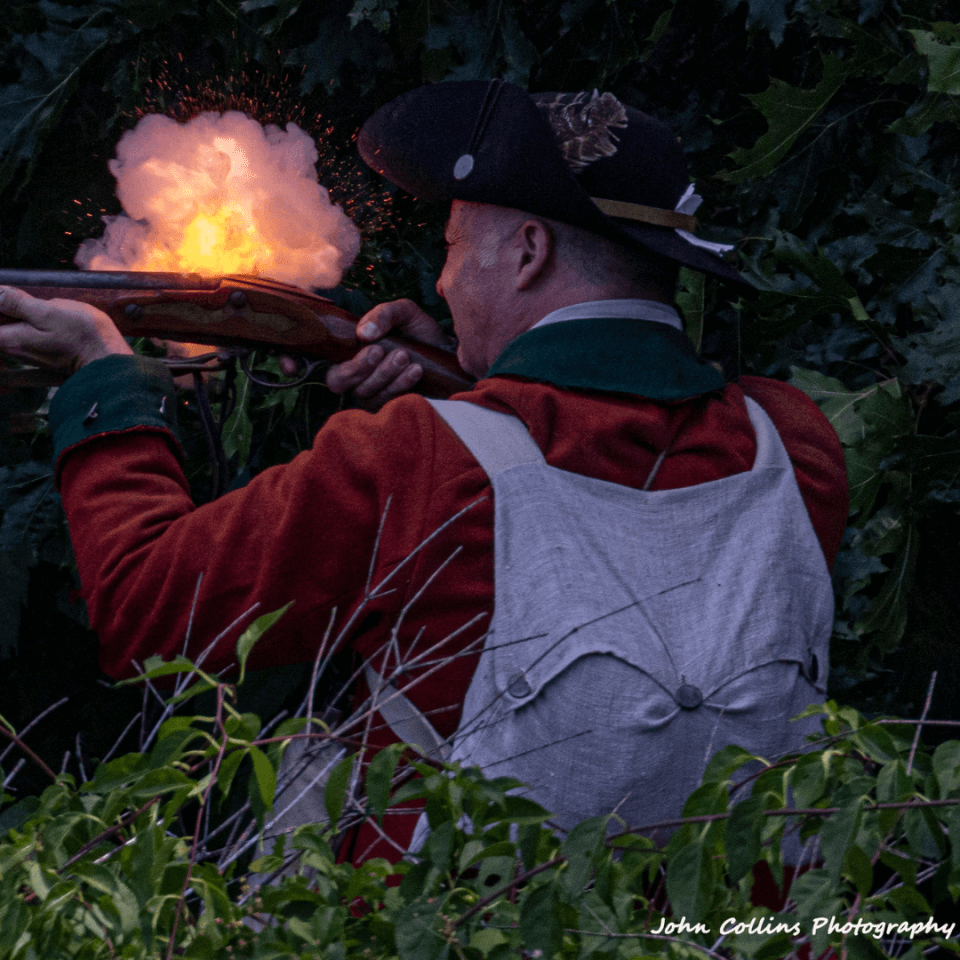 Redcoats & Rebels A soldier fires a musket