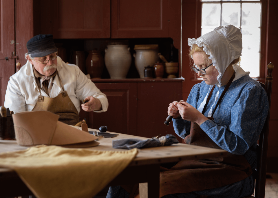 Two people working on shoes