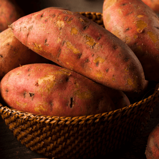 a basket of sweet potatoes